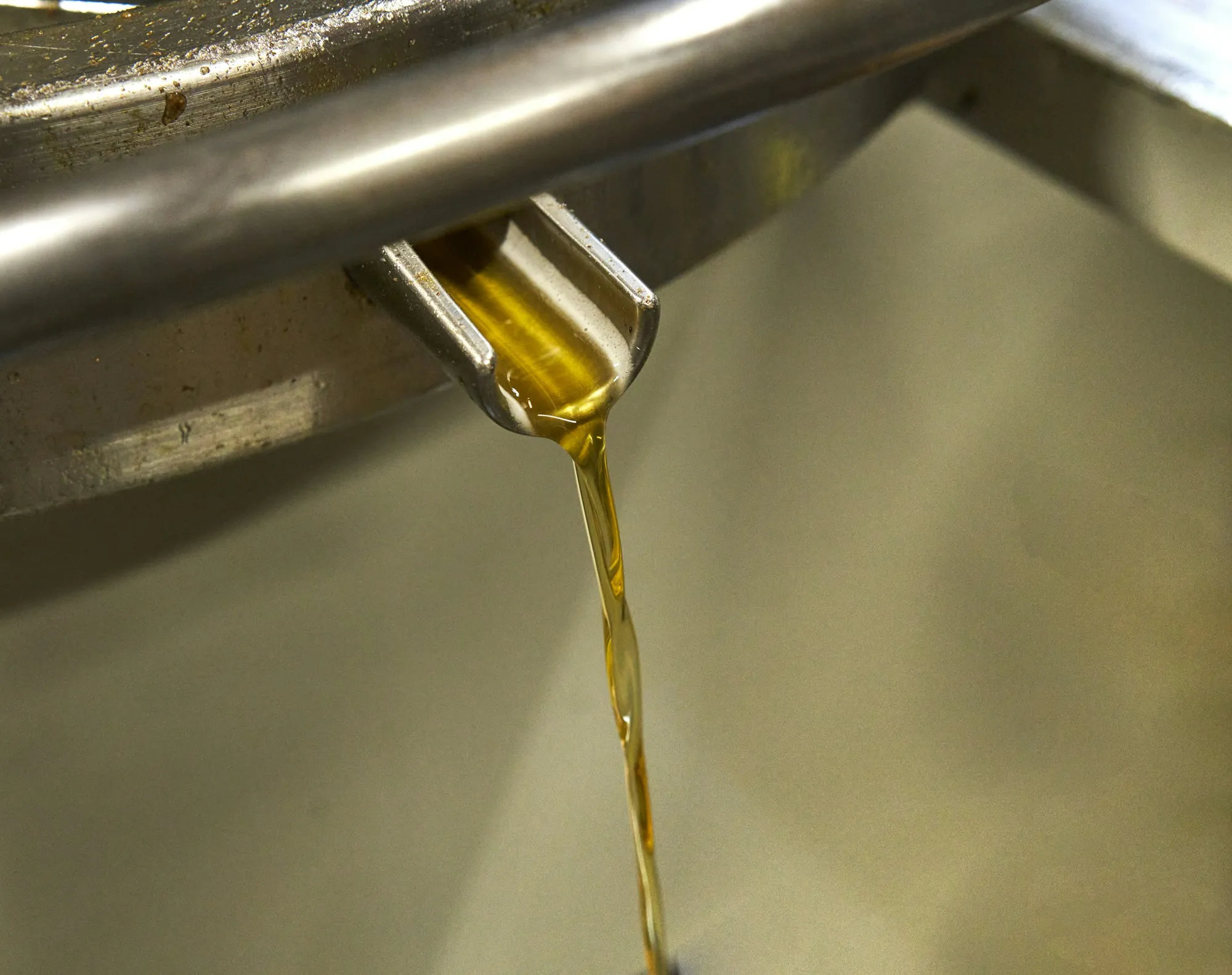 Motor oil pouring into an engine